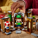 Kids playing with Lego Luigi and Lego Toad in the Luigi's Mansion Haunt-and-Seek expansion set.